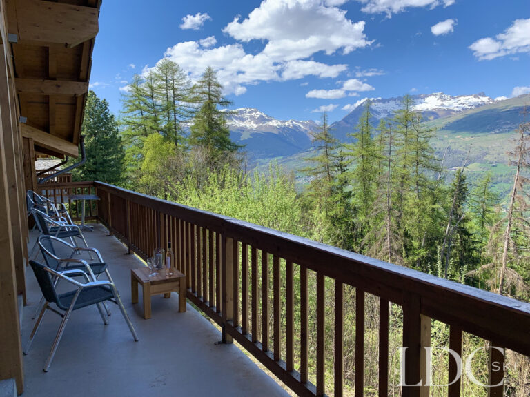 Balcony with panoramic mountain views at Chalet Flocon in Les Coches, La Plagne