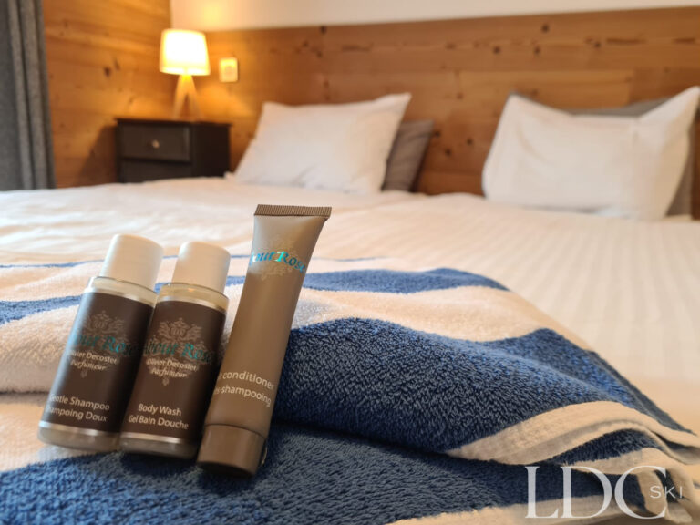 Double bed with chalet toiletries at Chalet Flocon
