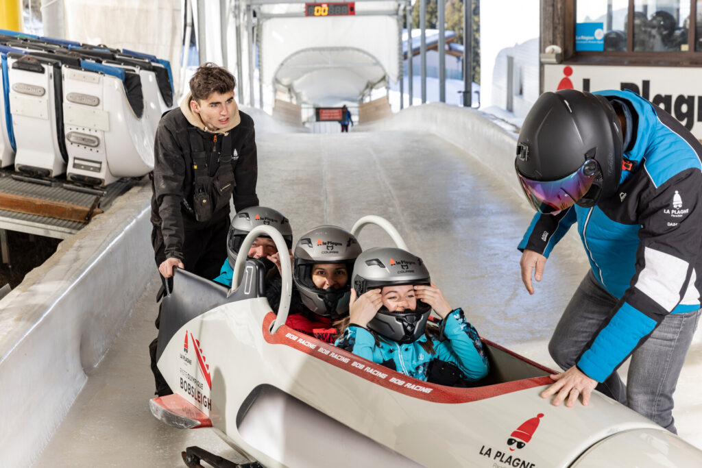 Visitors preparing for a bobsleigh experience on the Olympic track in La Plagne – © Louis Garnier / La Plagne
