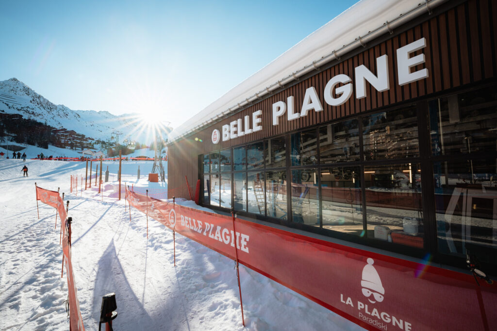 Skiers outside a modern lift station in the La Plagne ski area – © Yann Allegre / SAP / La Plagne