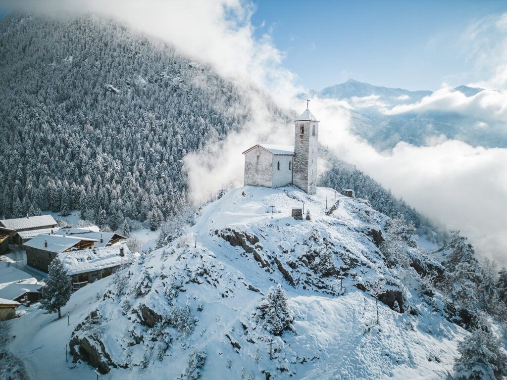Snow-covered Le Châtelard surrounded by winter mountain scenery near La Rosière