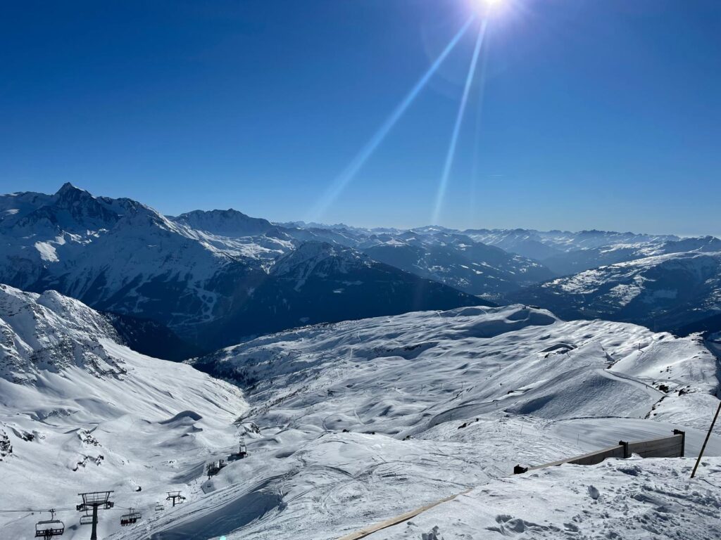 Panoramic view across the snowy pistes and mountains of the La Rosière ski area