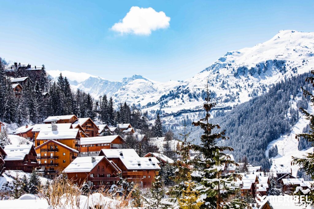Traditional Méribel chalets surrounded by snowy mountain scenery