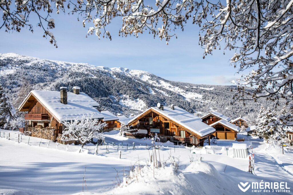Traditional chalet surrounded by deep snow and mountains in Méribel