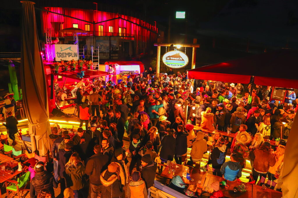 Crowds enjoying a lively evening après-ski event in Morzine