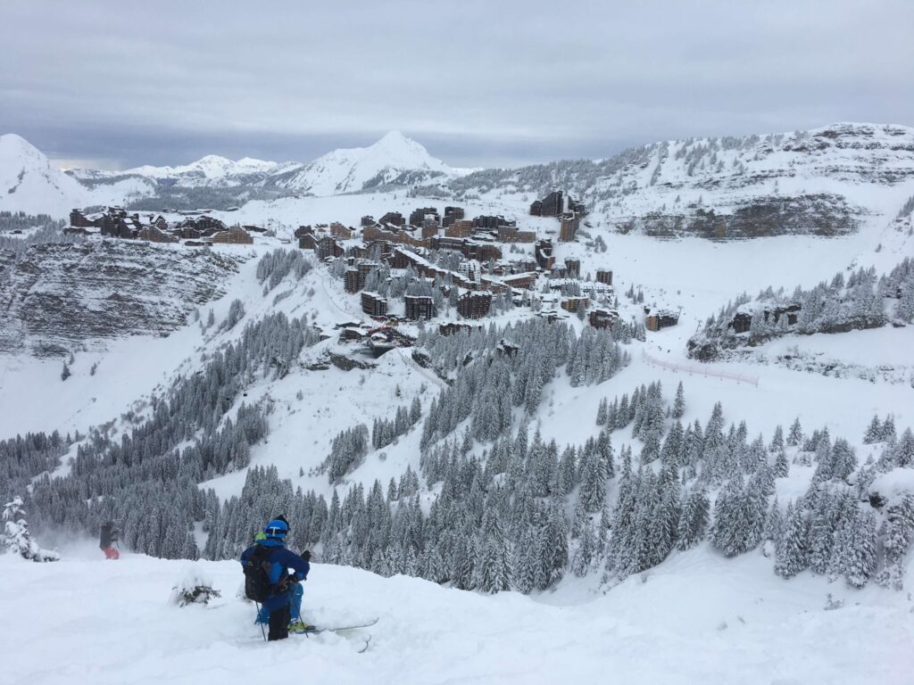 Skier descending through fresh snow on the slopes around Morzine