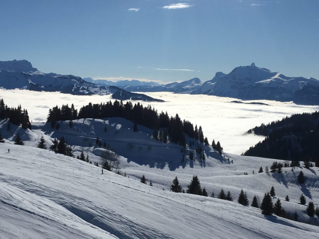 Snowy ski slopes overlooking a spectacular sea of clouds near Morzine