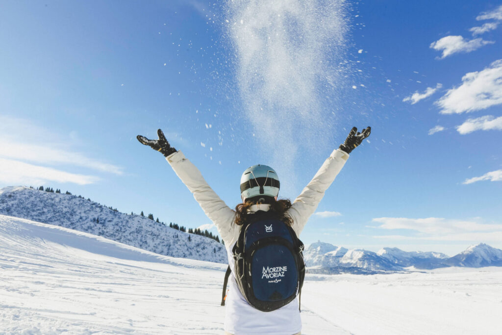 Snowboarder enjoying a sunny snow-covered slope in Morzine