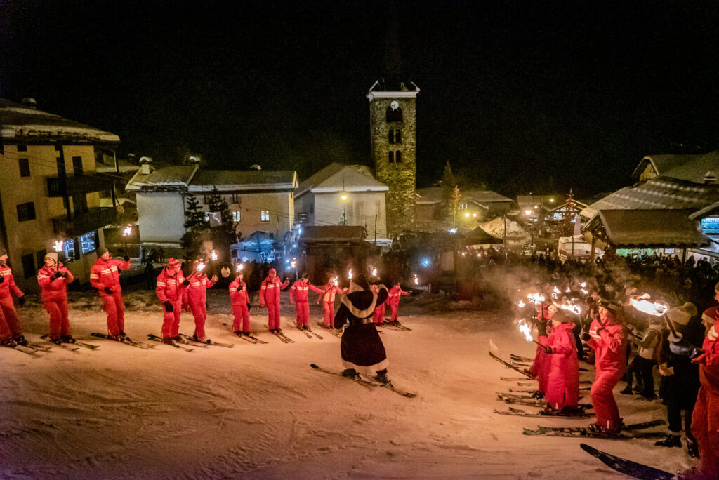 Torchlight descent through St Martin de Belleville on a winter evening