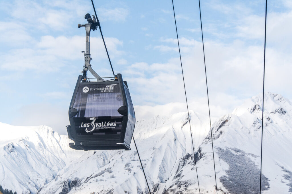 Gondola travelling above the snowy slopes of St Martin de Belleville