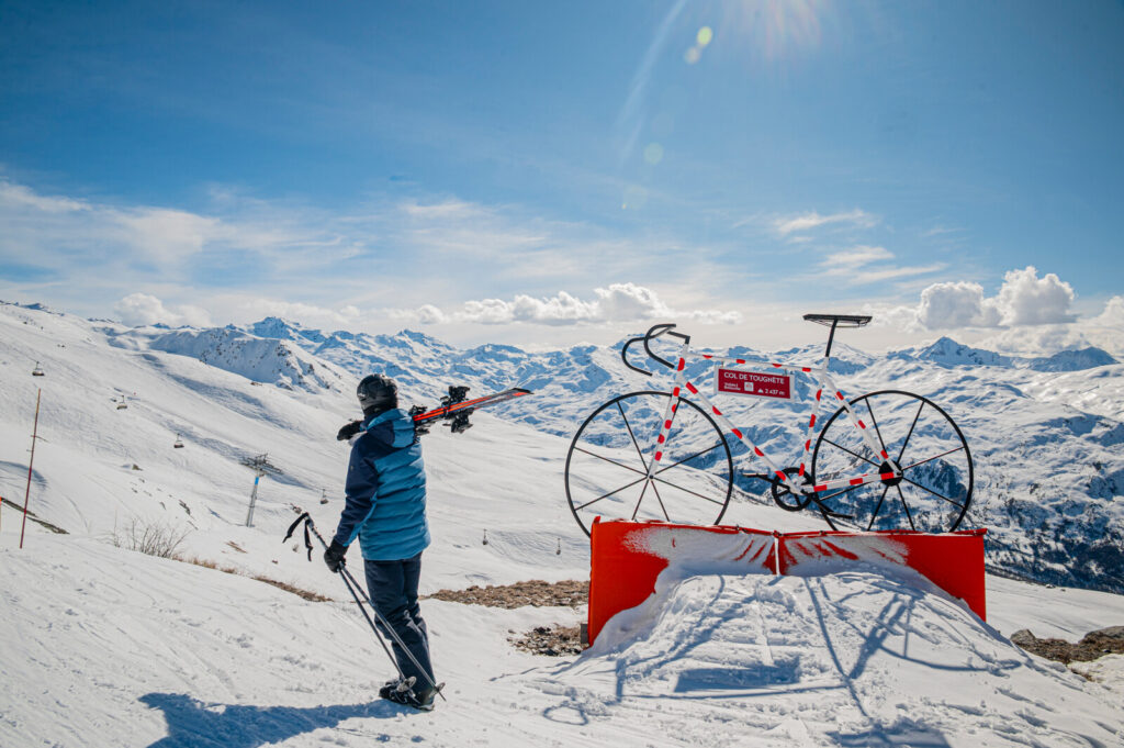 Skier enjoying a sunny piste in the Three Valleys above St Martin de Belleville
