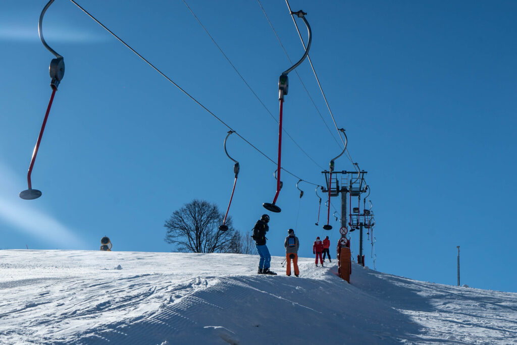 Ski lift crossing the snowy slopes above St Martin de Belleville
