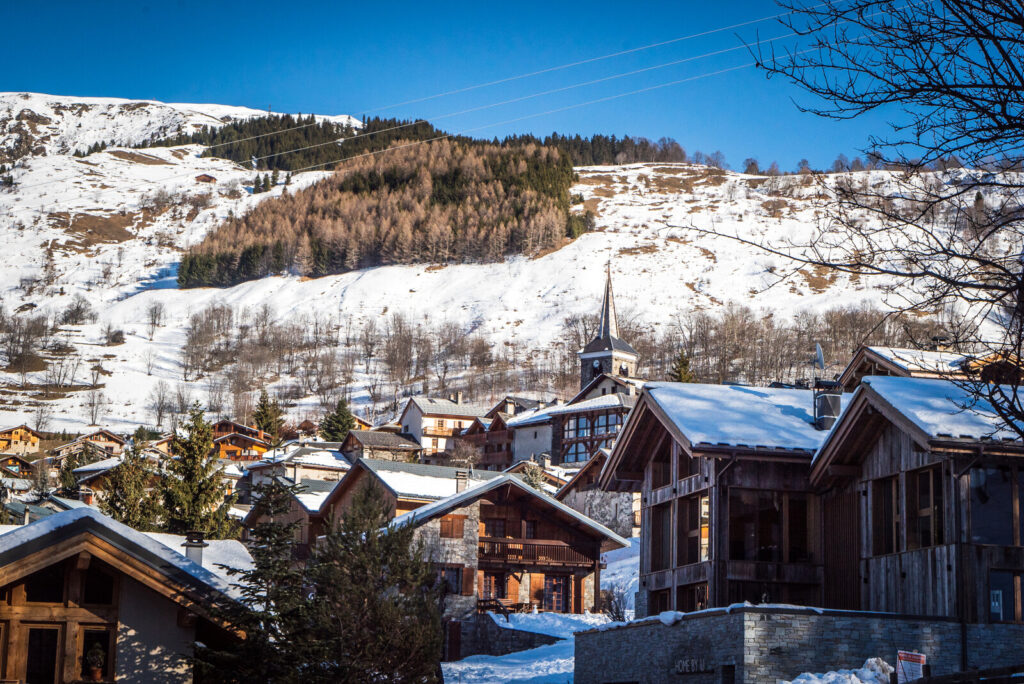 Traditional chalets overlooking the Belleville Valley and snowy mountains