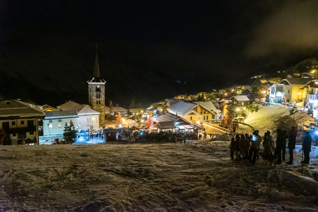 St Martin de Belleville illuminated at night beneath the mountains
