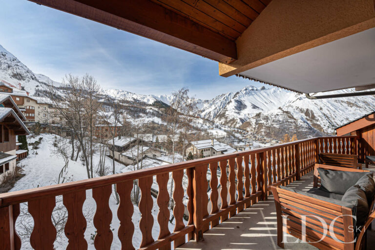 Balcony at Prestige No.5 with views across the snowy mountains and village of St Martin de Belleville