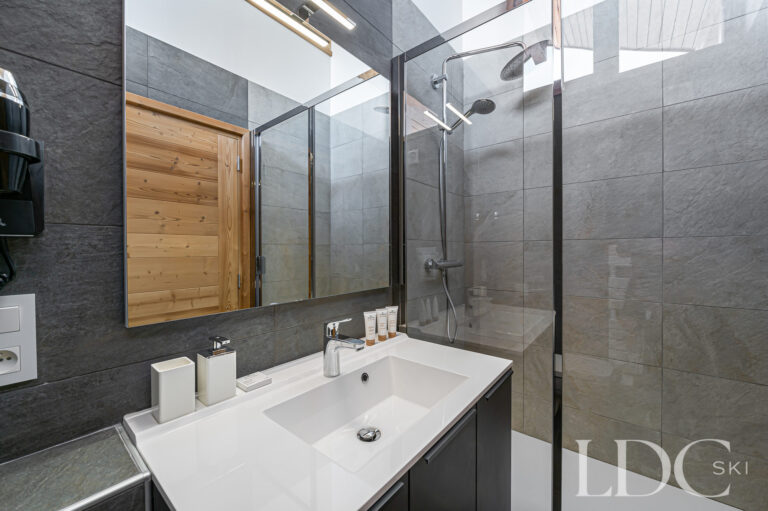 Contemporary bathroom at Prestige No.5 with basin and large walk-in rainfall shower