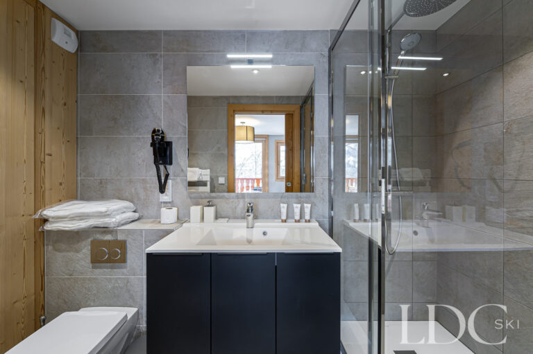 Contemporary bathroom at Prestige No.5 with basin, bath and overhead shower