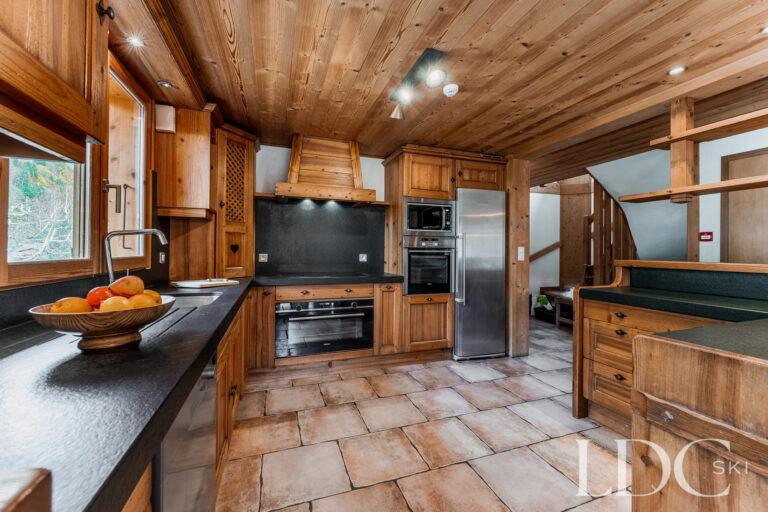 Traditional timber kitchen at Cairn Lodge in Morzine