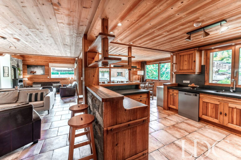 Spacious kitchen leading through to the dining area at Cairn Lodge