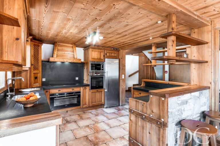 Timber kitchen with breakfast bar at Cairn Lodge