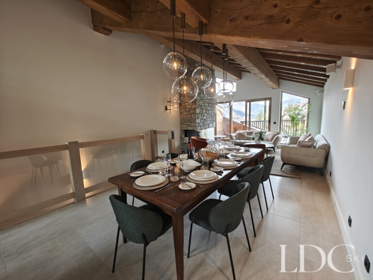 Open-plan dining and living area with mountain views at Chalet Chardon in St Martin de Belleville
