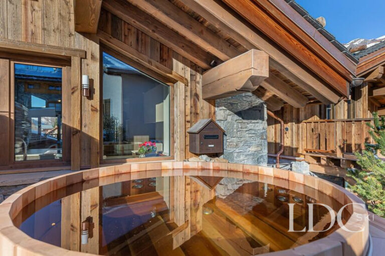 Outdoor hot tub surrounded by snow at Chalet Chardon in St Martin de Belleville