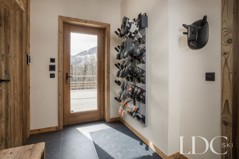 Chalet Aurea ski and boot room with equipment storage