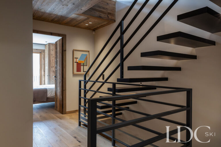 Chalet Aurea interior with contemporary open staircase