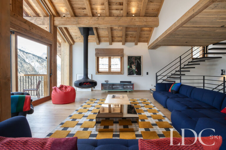 Chalet Aurea spacious lounge with exposed timber ceiling and contemporary furnishings