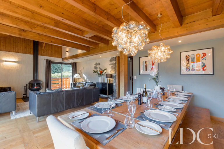 Dining room leading through to the lounge at Chalet Aux Joux in Morzine