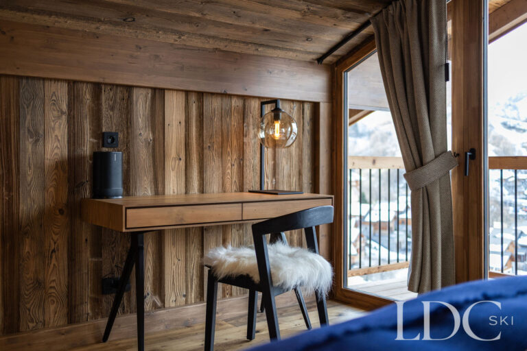 Double bedroom with balcony doors and mountain views at Chalet de Beauvoir in St Martin de Belleville