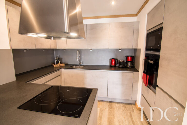Modern kitchen at Chalet Astragle with island hob and contemporary cabinetry