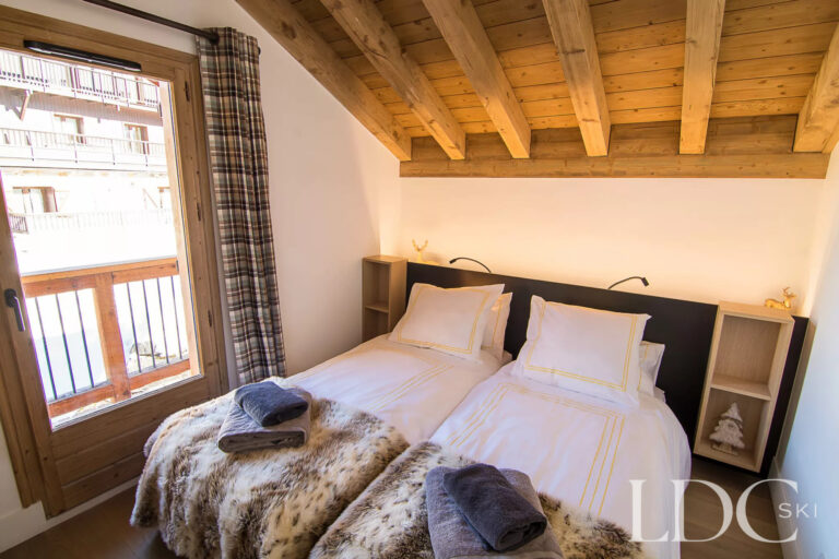 Bernardie double bedroom with exposed timber ceiling
