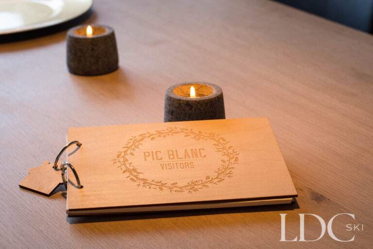 Chalet Le Pic Blanc welcome book and table setting