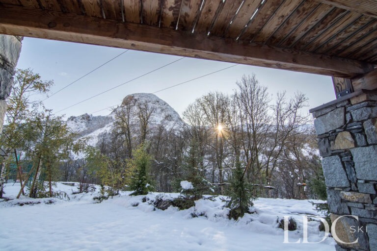 Snow-covered garden and mountain scenery from Chalet Le Pic Blanc