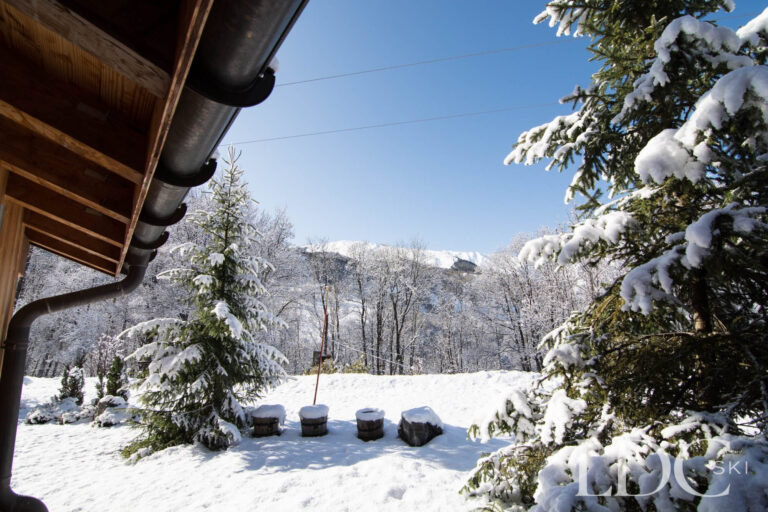 Snowy garden and mountain views from Chalet Le Pic Blanc