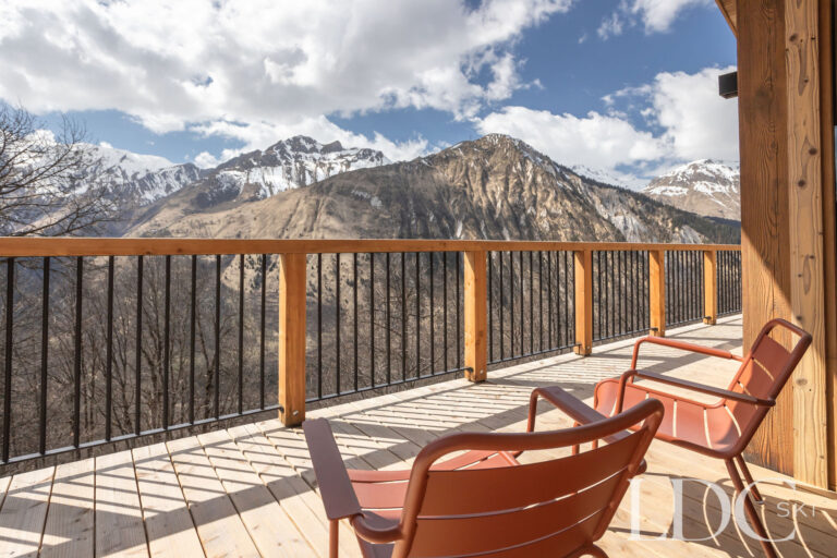 Balcony at Chalet Lenafaju with seating and panoramic mountain views in St Martin de Belleville