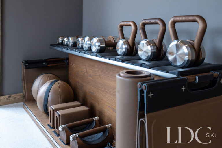 Private gym at Chalet Lenafaju with kettlebells and strength-training equipment