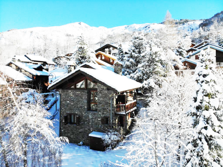 Exterior of Chalet Malina surrounded by snow in St Martin de Belleville