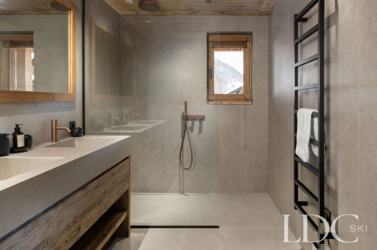 Contemporary bathroom at Chalet Montana with large walk-in shower and wooden vanity