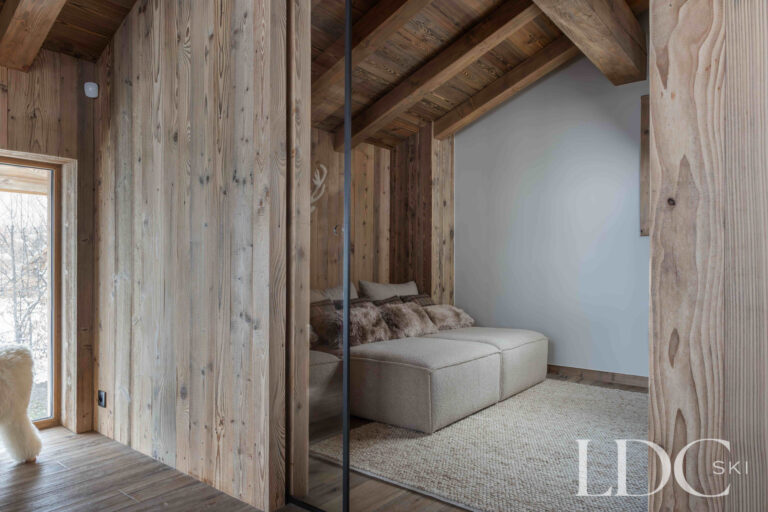Cinema lounge at Chalet Montana with built-in seating and timber-clad alpine interiors