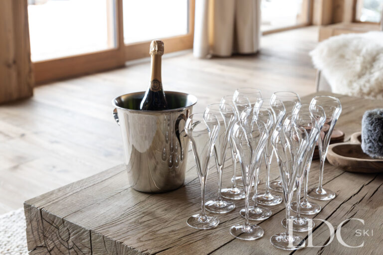 Dining table at Chalet Montana with champagne and glassware ready for guests