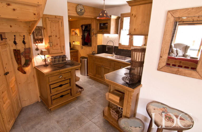 Traditional timber kitchen at Chalet Saint Peres with central preparation island
