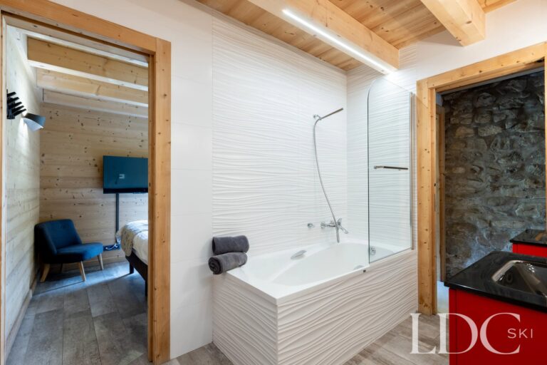 Bathroom with bath and contemporary fittings at La Ferme de la Couttetaz