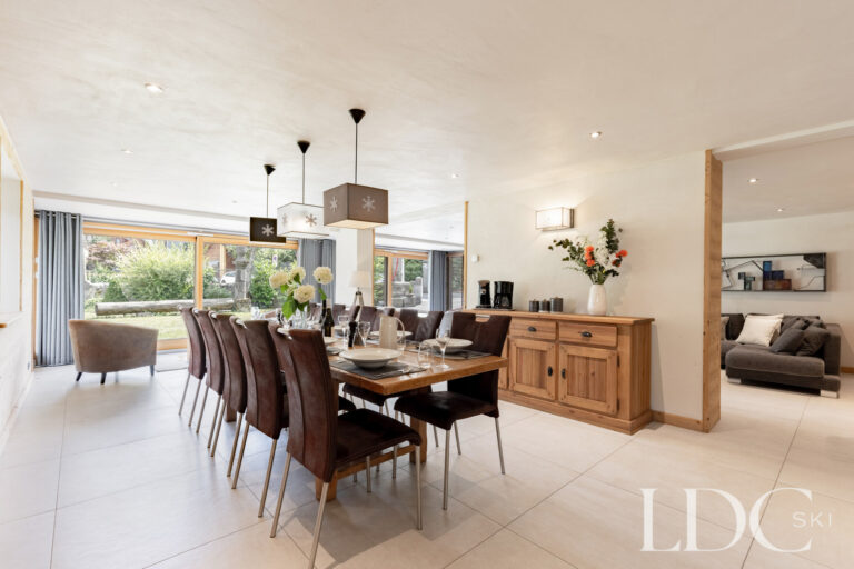 Spacious dining room overlooking the garden at La Ferme de la Couttetaz in Morzine