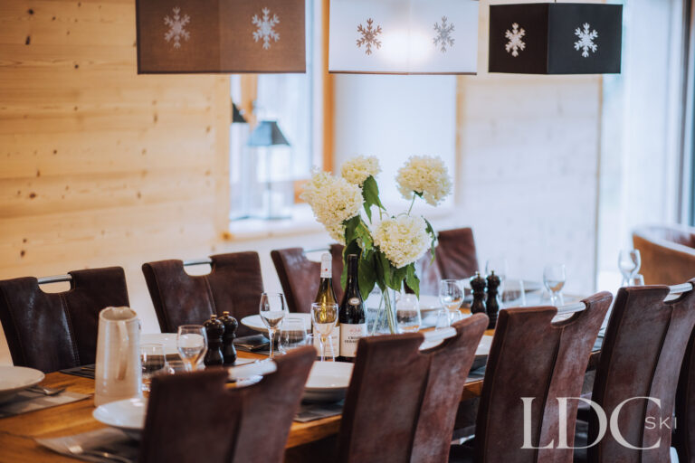 Large dining table laid for guests at La Ferme de la Couttetaz