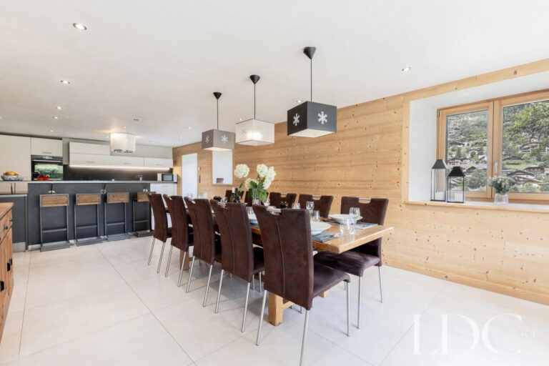 Open-plan dining room and kitchen at La Ferme de la Couttetaz