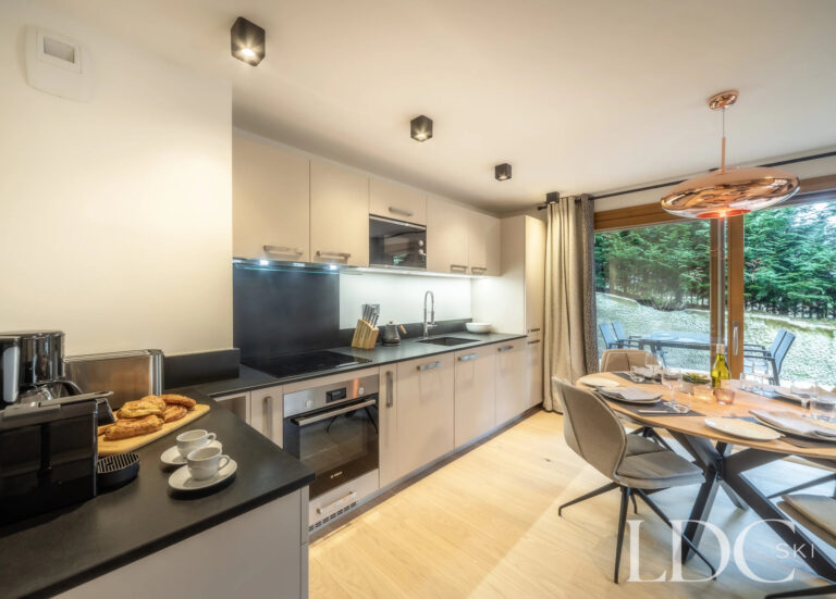 Les Deux Frères lounge and dining area with contemporary furnishings and large windows