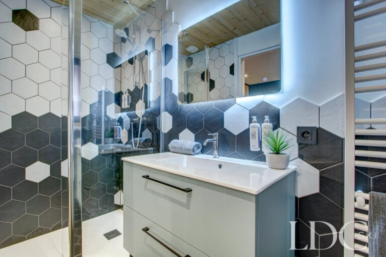 Contemporary shower room with hexagonal feature tiles at Piste Bleue