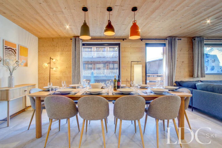 Dining area leading into the open-plan lounge at Piste Bleue